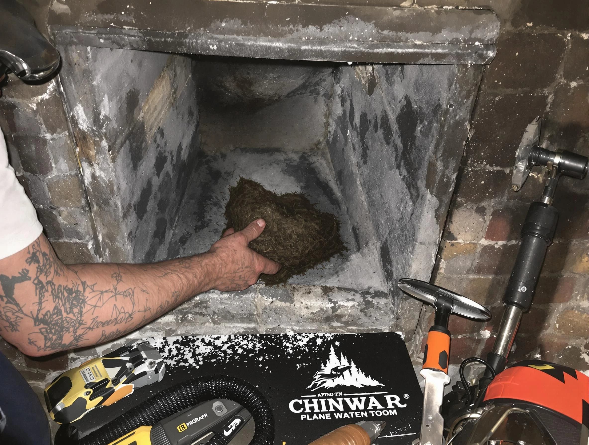 Manchester Chimney Sweep safely removing debris and screening chimney in Manchester, VA
